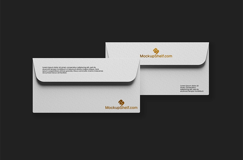 Two white envelopes arranged side by side on a dark background