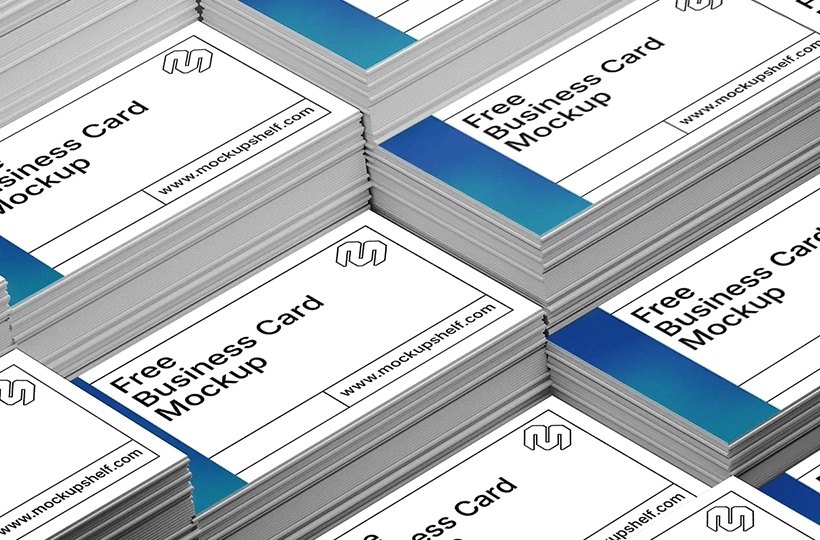 Stacked business cards arranged in multiple neat piles viewed from above