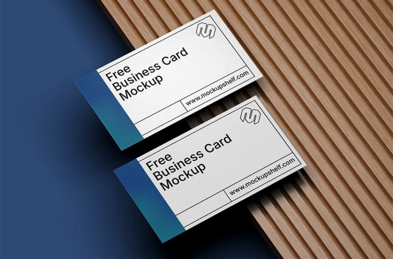 Two business cards placed on a wooden slatted surface with a blue background contrast