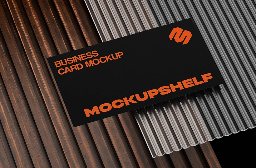 Black business card placed on mixed ribbed wood and metal textured surface