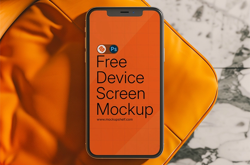 Free iPhone Mockup – top view of smartphone on orange chair with marble floor background | MockupShelf