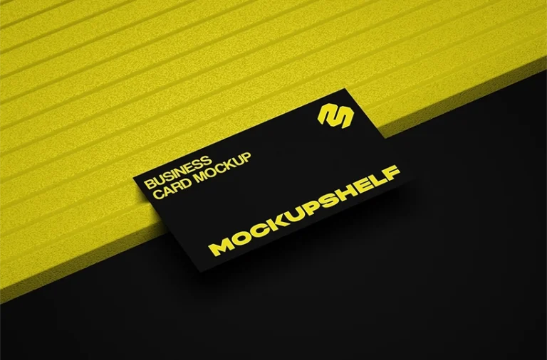 Free business card mockup on yellow surface PSD with black card and dramatic high contrast shadow