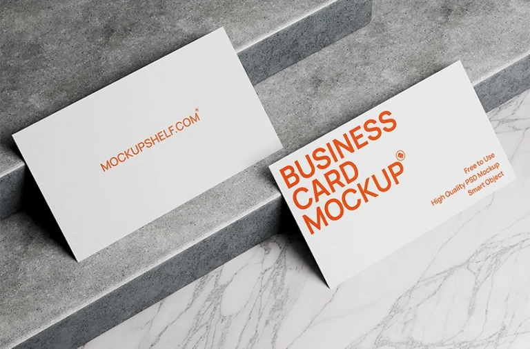 Free business card mockup on marble PSD — two white cards on marble surface with concrete ledge background