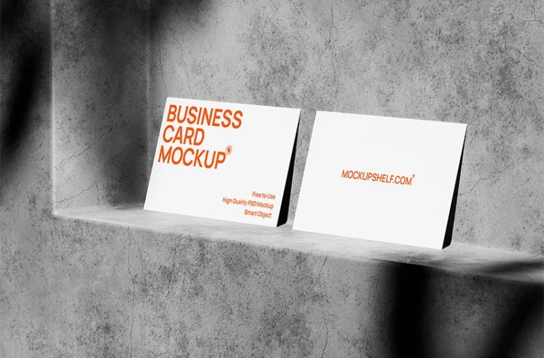 Free business card mockup on concrete PSD with two clean cards and directional studio shadows