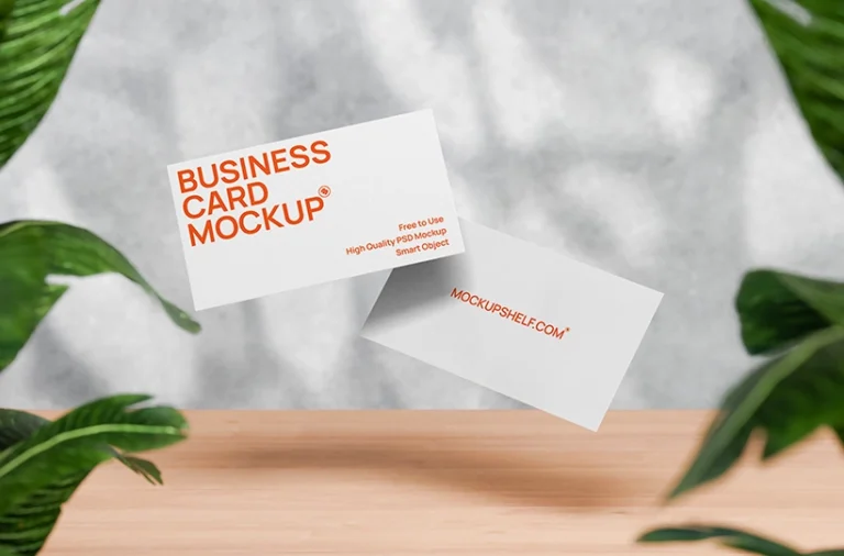 Free floating business card mockup PSD with two cards, leaf framing, and soft studio shadows