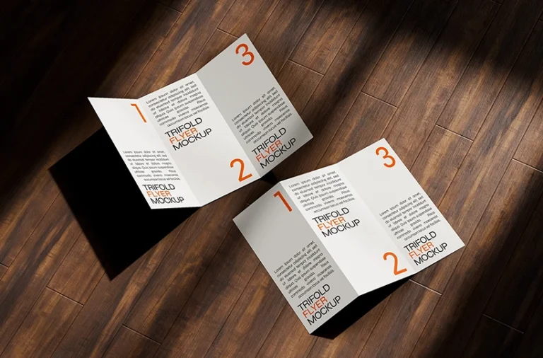 Free trifold flyer mockup on a wooden surface