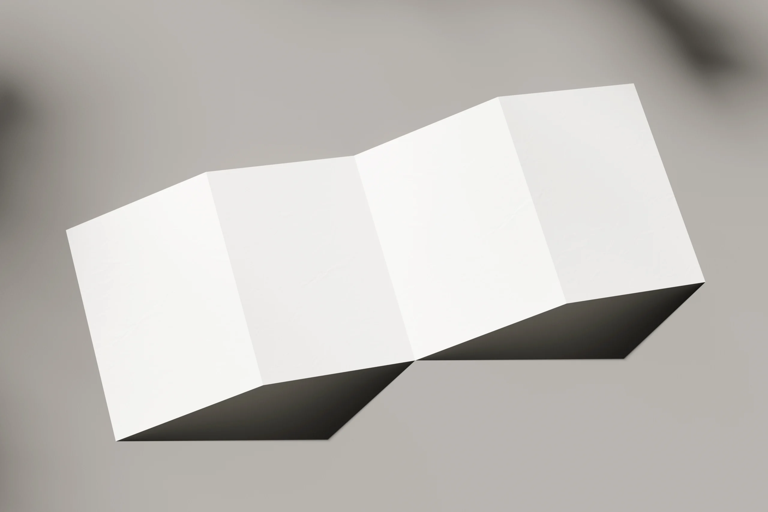 Blank A5 four fold flyer mockup on a flat surface
