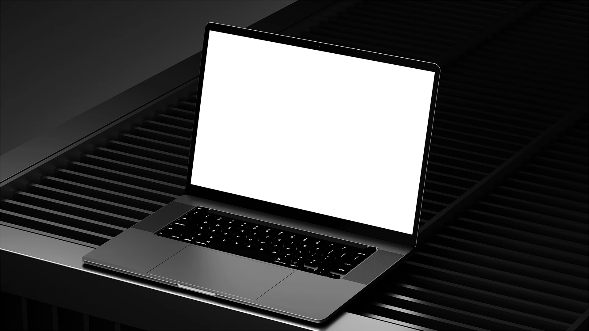 Blank laptop mockup on a dark ribbed surface